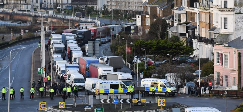 Food is pulled through the fence for truckers trapped in England